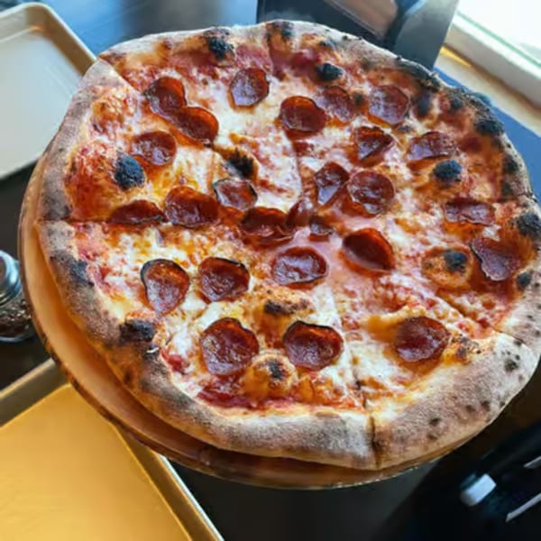 A whole pepperoni pizza from Crab Rock PIZZA, with a crispy crust and melted cheese.